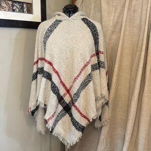 Knit poncho tan, black and red. No tags for brand. One size fits alls all.
